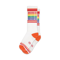 Pair of white crew socks with rainbow 'Brooklyn' text and orange cuffs. 