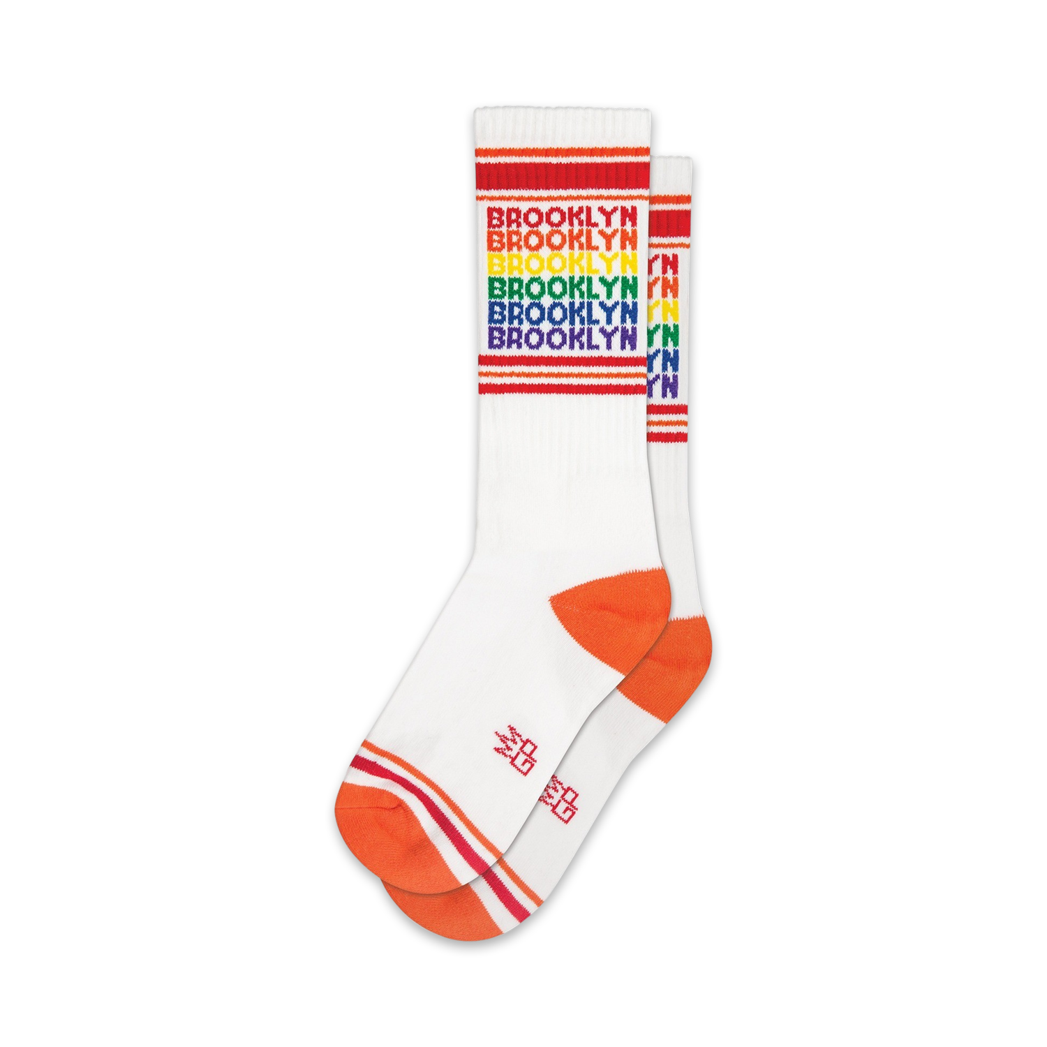 Pair of white crew socks with rainbow 'Brooklyn' text and orange cuffs. 