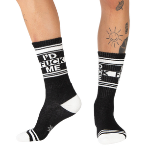 Lifestyle shot: Person wearing black 'I'd Fuck Me' socks with black shoes.