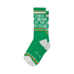 Pair of green crew socks with orange and white stripes and the text 'Check Me Out At The Library'.