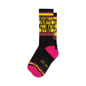 bold black, pink and yellow crew-length xl socks feature iconic meme text 'everything hurts and i'm dying' for men and women.   