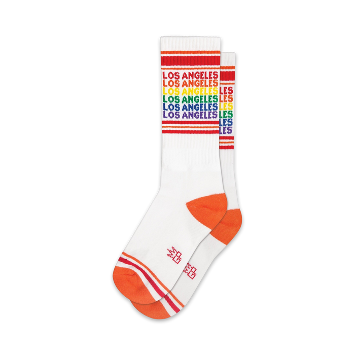 white socks with colorful horizontal rainbow stripes, orange toe, heel, and stripes above the heel. for men, women - crew xl. los angeles theme.   }}