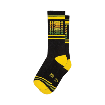 Crew socks in black with a repeating 'Tequila' pattern in yellow, orange, and green. Yellow and dark green stripes at the cuff.