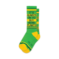 Pair of green and yellow crew socks with the text 'It's Always Ok To Buy More Plants' in black.  Features yellow and green stripes at the cuff.