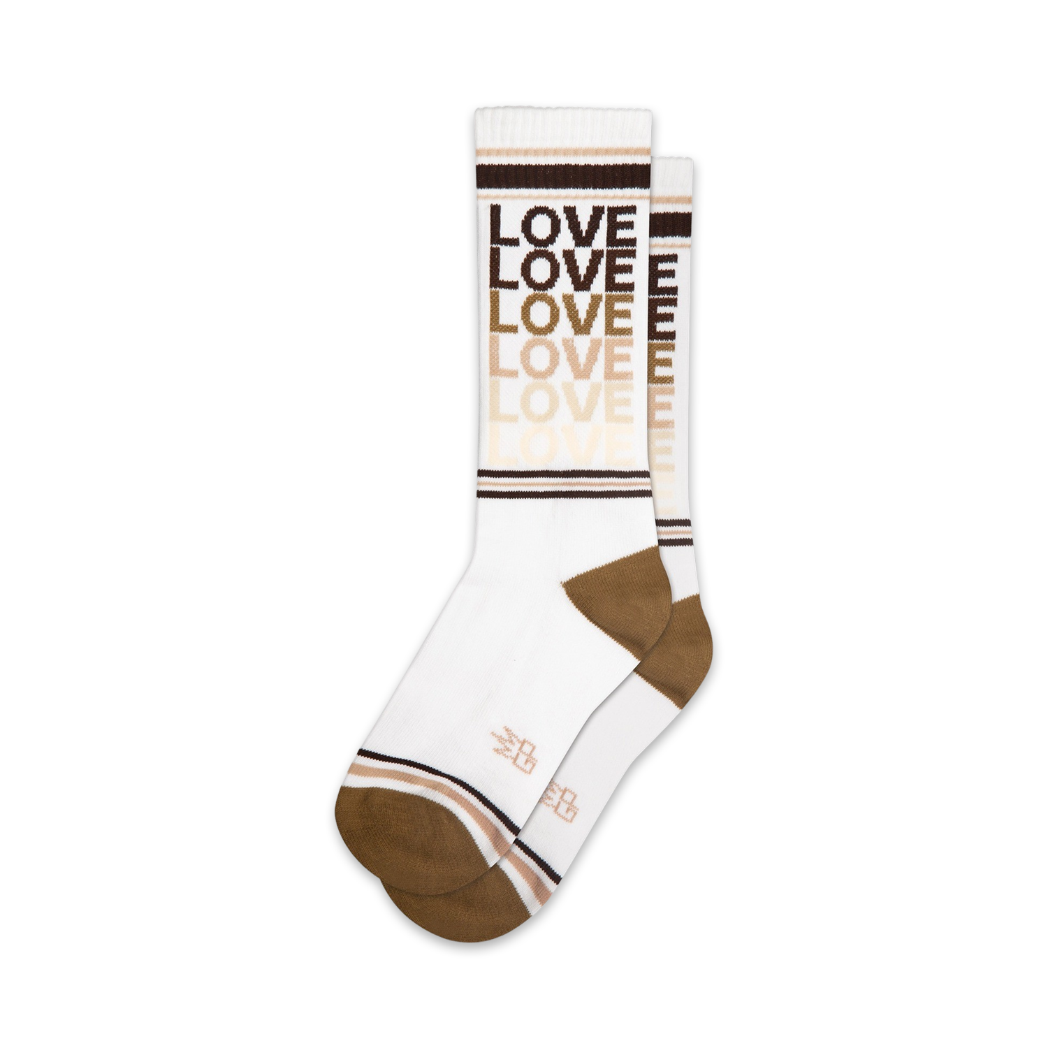 Lifestyle shot of model wearing rainbow 'Love' socks with rainbow platform sandals against a pink background.