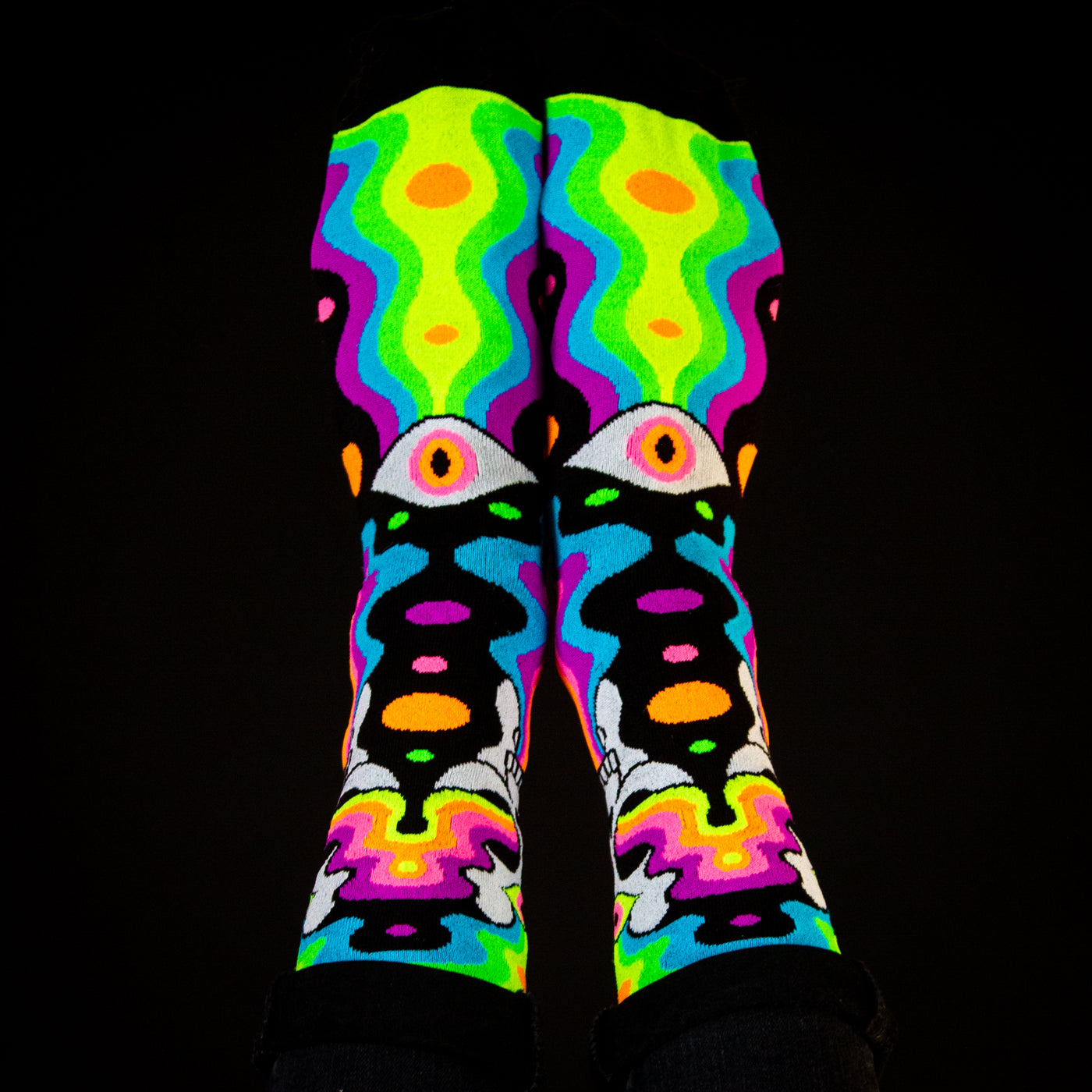 Flat lay: Pair of Eye of the Doomed socks laid flat, displaying the full design detail. [lf]