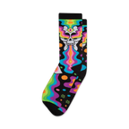 Crew socks with a black background, featuring a neon skull with a third eye vomiting rainbow swirls and colorful abstract shapes.
