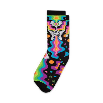 black crew socks feature colorful skulls with rainbow eyes and mouths surrounded by swirls and shapes.  