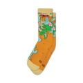 Pair of crew socks in mustard yellow with a whimsical design of a lizard lounging amidst cacti and desert flowers.  The socks have off-white cuffs.