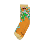 Pair of crew socks in mustard yellow with a whimsical design of a lizard lounging amidst cacti and desert flowers.  The socks have off-white cuffs.