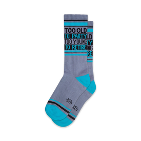 fun and festive novelty socks in gray, blue, and black with the words "too old to party too young to retire"