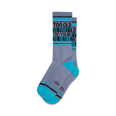 fun and festive novelty socks in gray, blue, and black with the words "too old to party too young to retire"