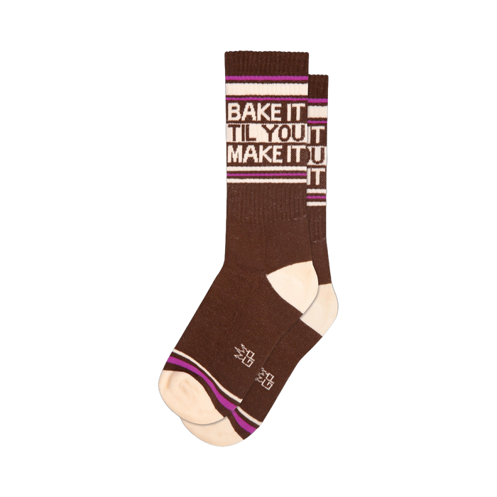 Brown crew socks with off-white and purplish-pink stripes.  The socks feature a 'Bake It Til You Make It' graphic.