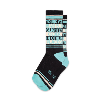 blue and white striped socks with blue toes and heels. text on front reads: "young at heart but slightly older in other places". men's/women's xl crew length sock.   