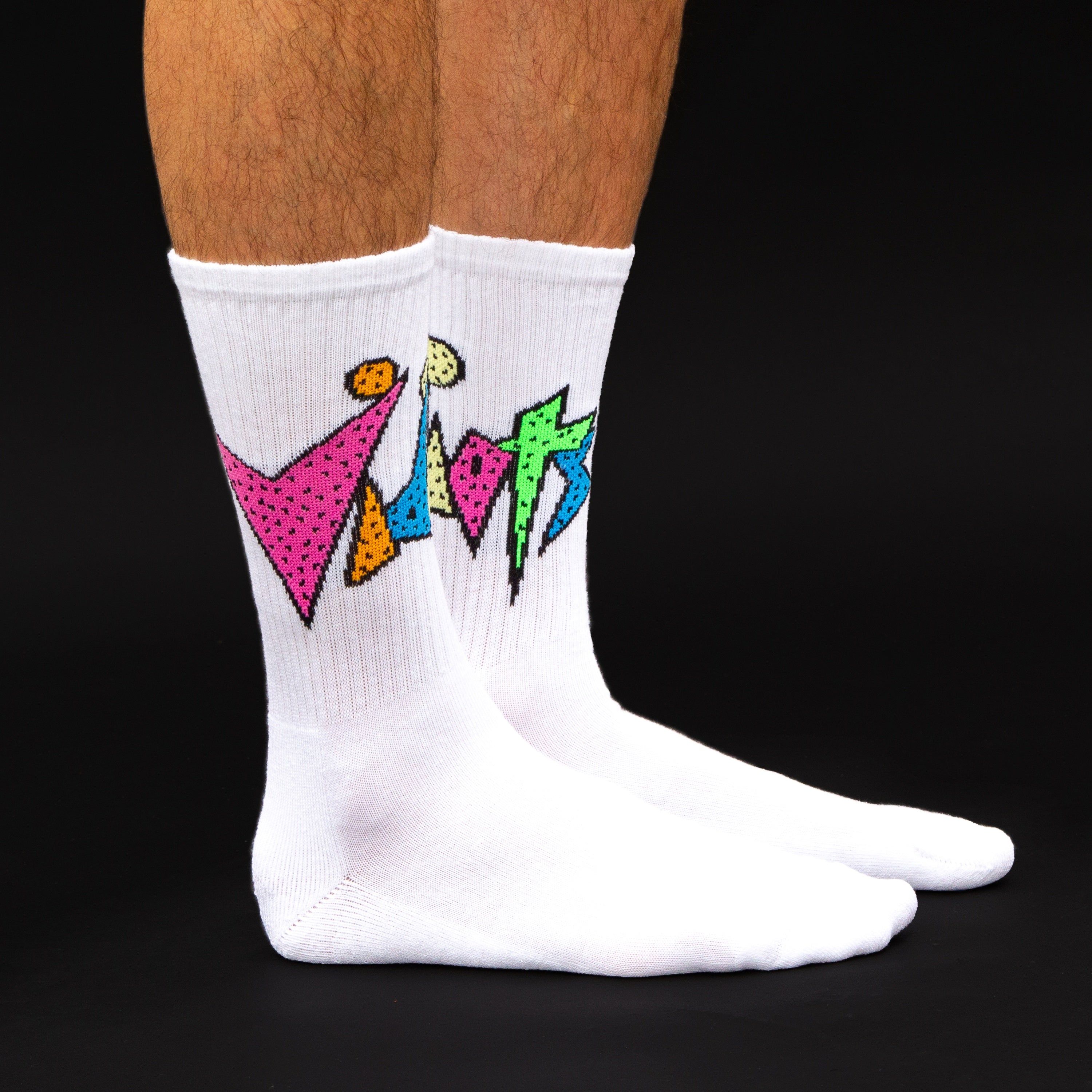 Lifestyle shot showing the Vidiots socks on a person's legs against a black background. [lf]