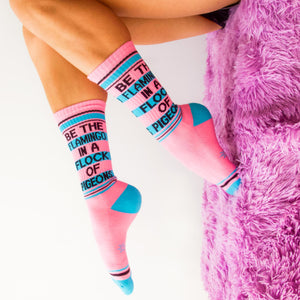 A pair of pink socks with the words 