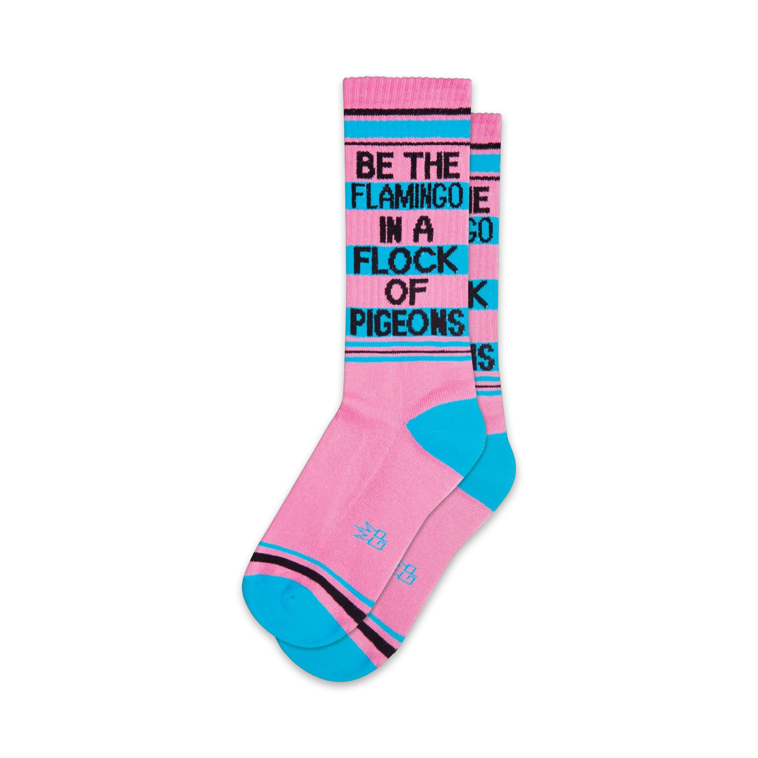 Pair of pink crew socks with teal accents and the phrase 'Be the flamingo in a flock of pigeons' in black.