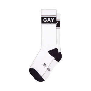 Pair of white crew socks with black 'GAY' band across the mid-leg. Black cuffs and toes.