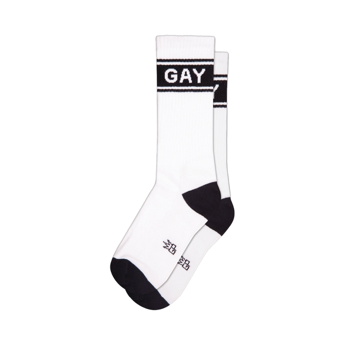 Pair of white crew socks with black 'GAY' band across the mid-leg. Black cuffs and toes.