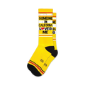 Pair of yellow crew socks with black and red stripes and the text 'Someone in California Loves Me'.