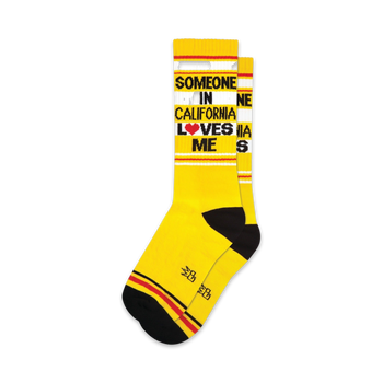 yellow crew xl socks with black and red stripes and "someone in california loves me" text.  