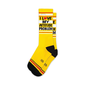 yellow socks with black toes and heels and a red and white striped top, "i love my attitude problem" repeating logo on the leg, crew xl length, for men and women.   