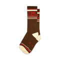 Pair of brown crew socks with red and white stripes and the text 'I Dig Mushrooms'.