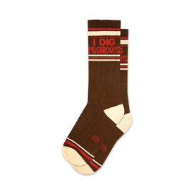 brown and white crew socks with the message "i dig mushrooms" written in red on the brown part of the sock.  