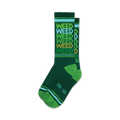 A pair of green crew socks with a repeating 'WEED' pattern in shades of green, gold, and light blue. The socks have green and light blue stripes at the cuff.
