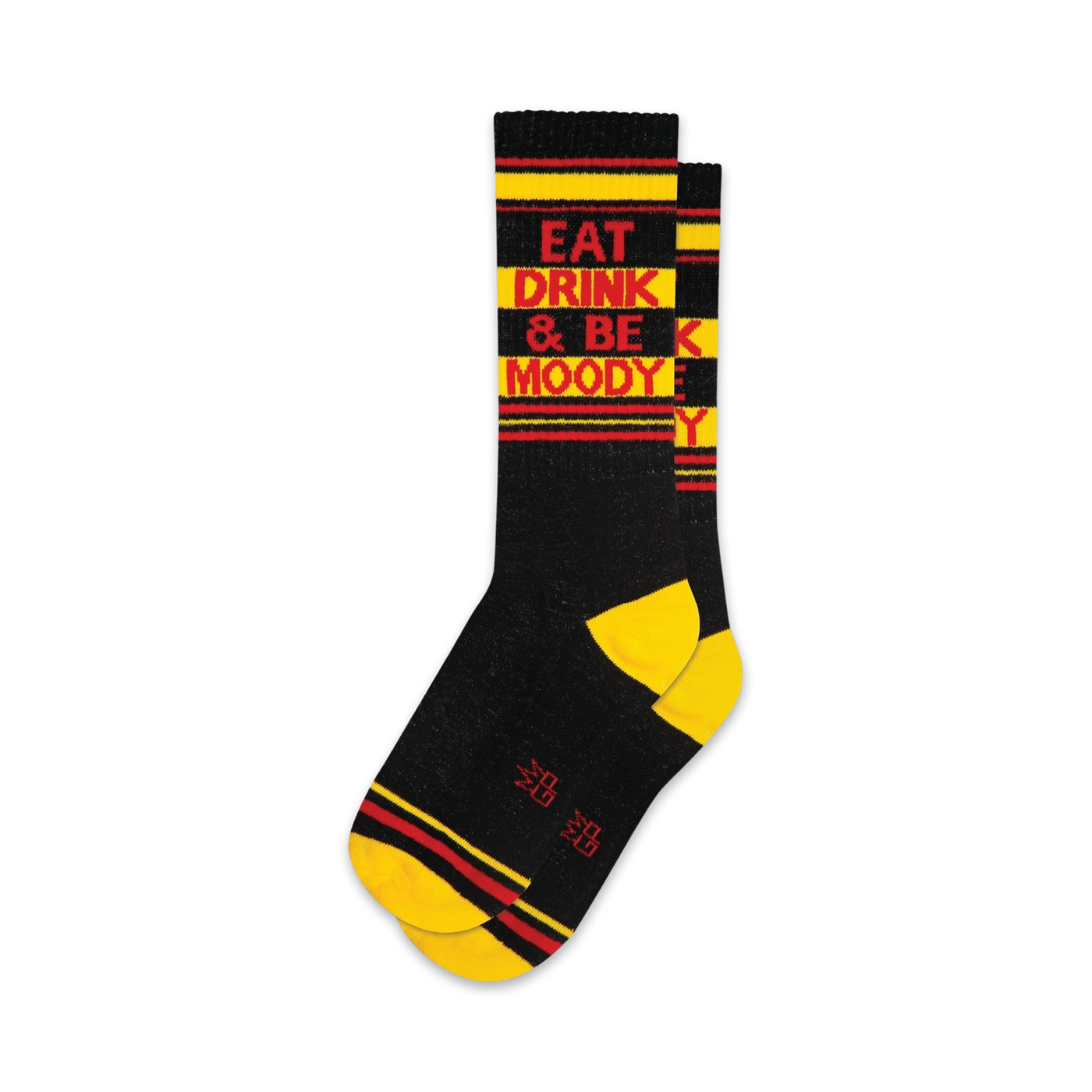 A pair of black crew socks with yellow and red stripes. The socks feature the text 'Eat Drink & Be Moody' in red.