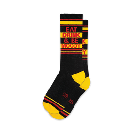black socks with yellow toes, heels, and cuffs. red and white striped legs. 'eat drink & be moody' in red and yellow letters on the front. crew length, for men and women.  / 
