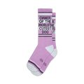 Pair of lavender crew socks with a dark gray 'Owner of the World's Cutest Dog' graphic and white/gray stripes near the cuffs.
