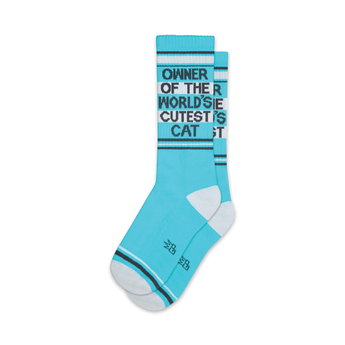 blue socks with white toes, heels, and cuffs that say 'meow' on toes and 'owner of the world's cutest cat' on cuffs. crew, for men and women.   