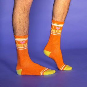 A pair of orange socks with the words 