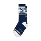 Pair of navy blue crew socks with white and gold stripes and the text 'Classy and Gassy' printed on them.