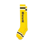 Pair of yellow knee-high socks with black 'BEER' vertical text and black and white stripes near the cuff.