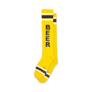yellow knee high socks with black stripes and text that reads 