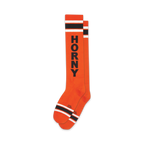 Pair of orange knee-high socks with bold black 'HORNY' lettering and black-and-white stripes at the top and bottom.