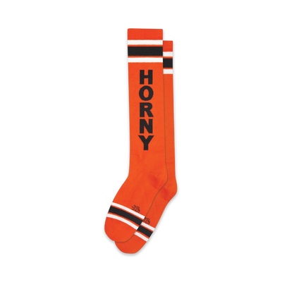 knee-high socks in bright orange with black and white stripes and 'horny' printed boldly across them.  