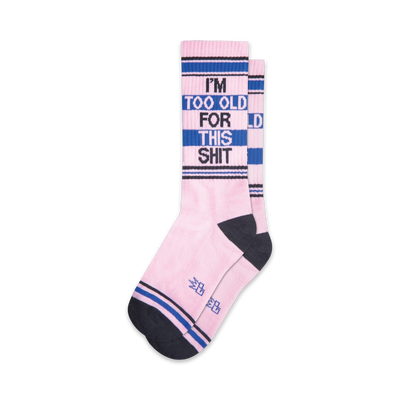 pink socks with black toe and heel, blue and black stripes at top, and "i'm too old for this shit" written on the front.   