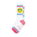 Pair of white crew socks with pink and blue stripes and a yellow smiley face with palm trees.