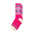 Pair of pink crew socks with a blue 'Cats Don't Give A Fuck' slogan.  Features white and blue stripes at the top and bottom.