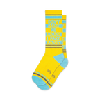A pair of yellow crew socks with teal accents. The socks feature the text 'Don't Make Me Laugh I Fart Easily' in a vertical design.