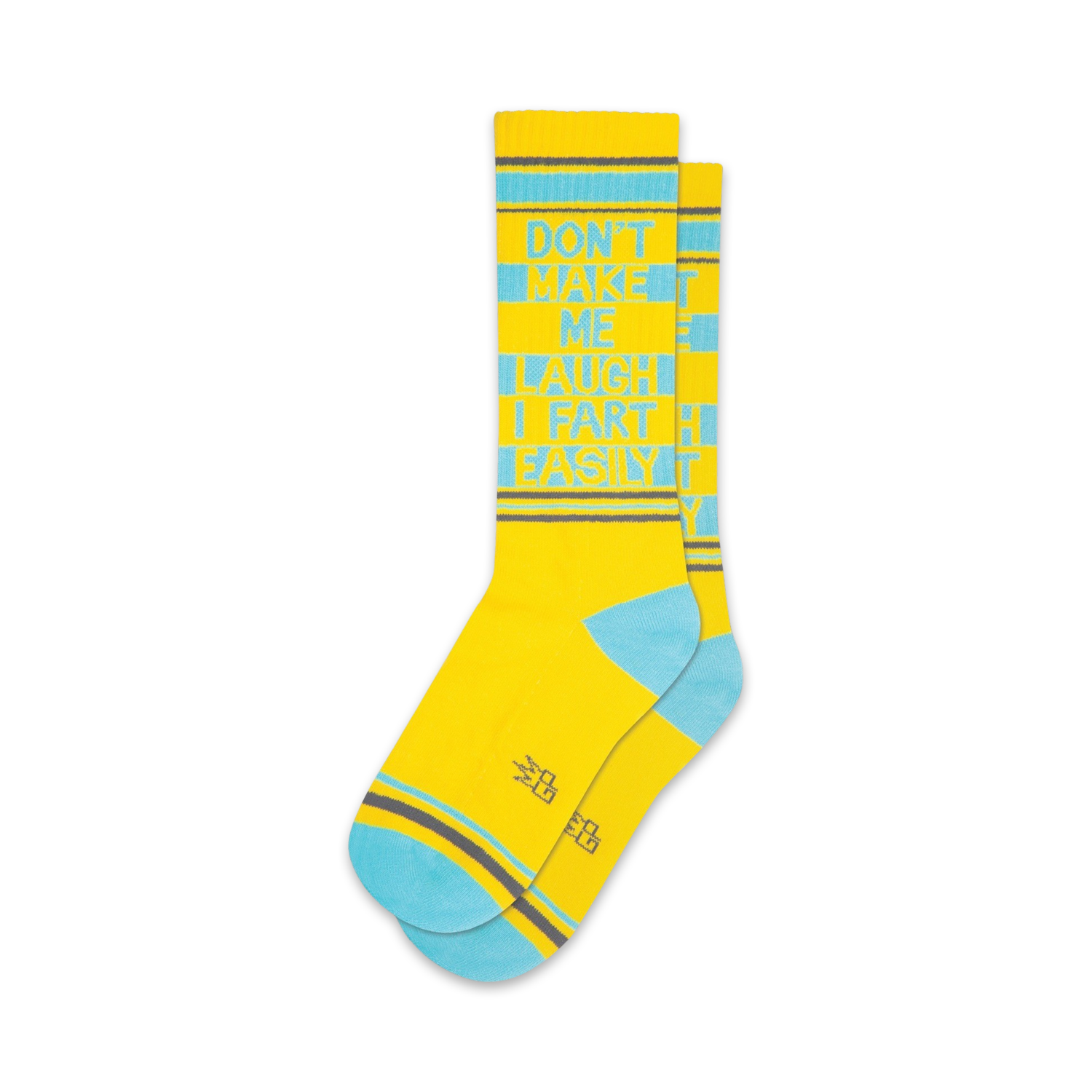 A pair of yellow crew socks with teal accents. The socks feature the text 'Don't Make Me Laugh I Fart Easily' in a vertical design.