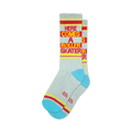 Pair of light gray crew socks with red and yellow stripes and the text 'Here Comes A Roller Skater'.  Features a teal colored heel and toe.