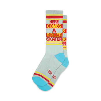light gray crew socks with blue toes & heels featuring "here comes a roller skater" in red & yellow letters.  