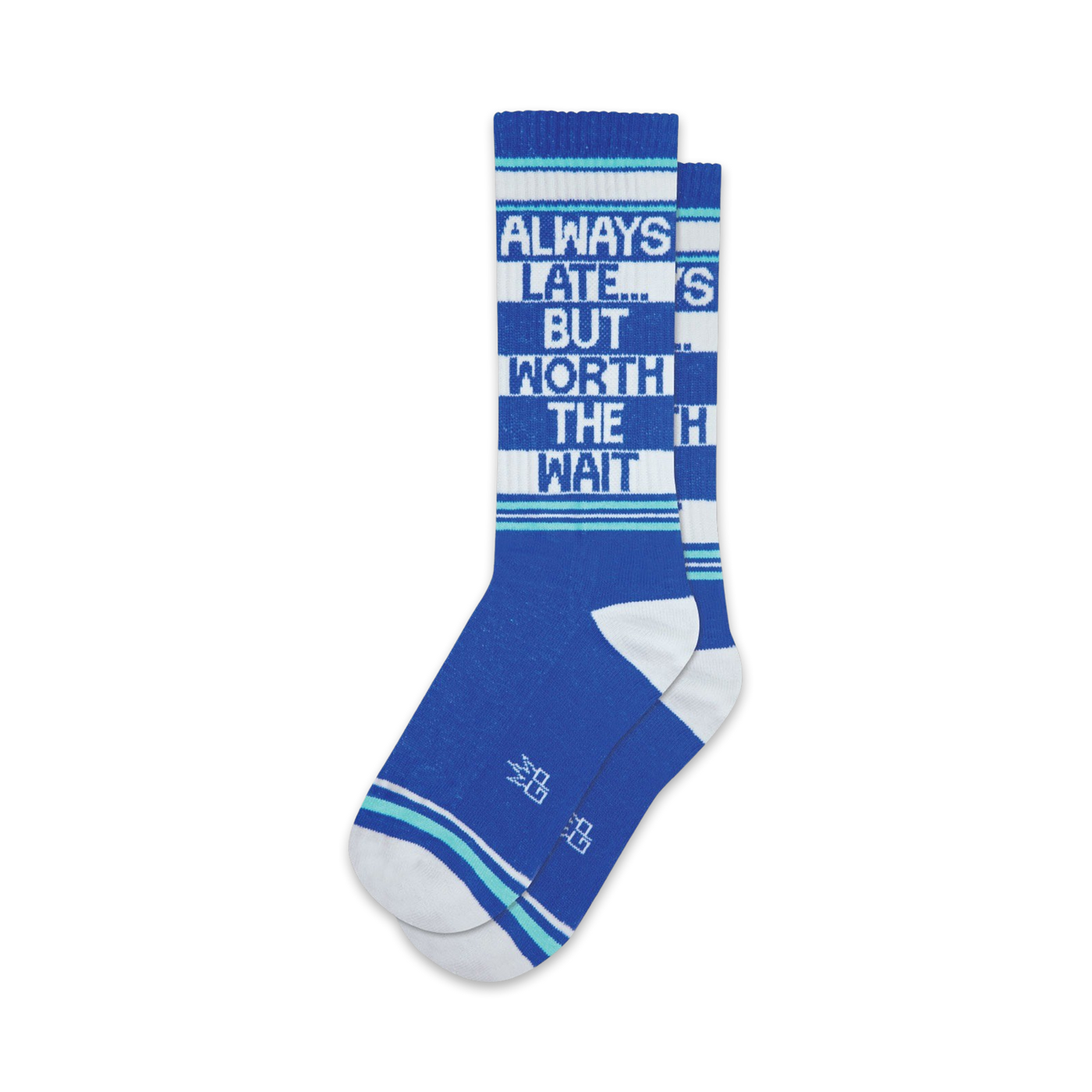 Pair of blue crew socks with white and teal stripes.  Text reads: 'Always Late... But Worth The Wait'.