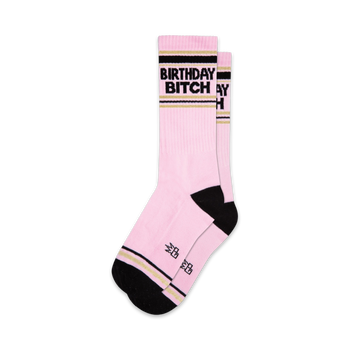 pink socks with black and gold stripes. unisex. xl crew length. "birthday bitch" text.   