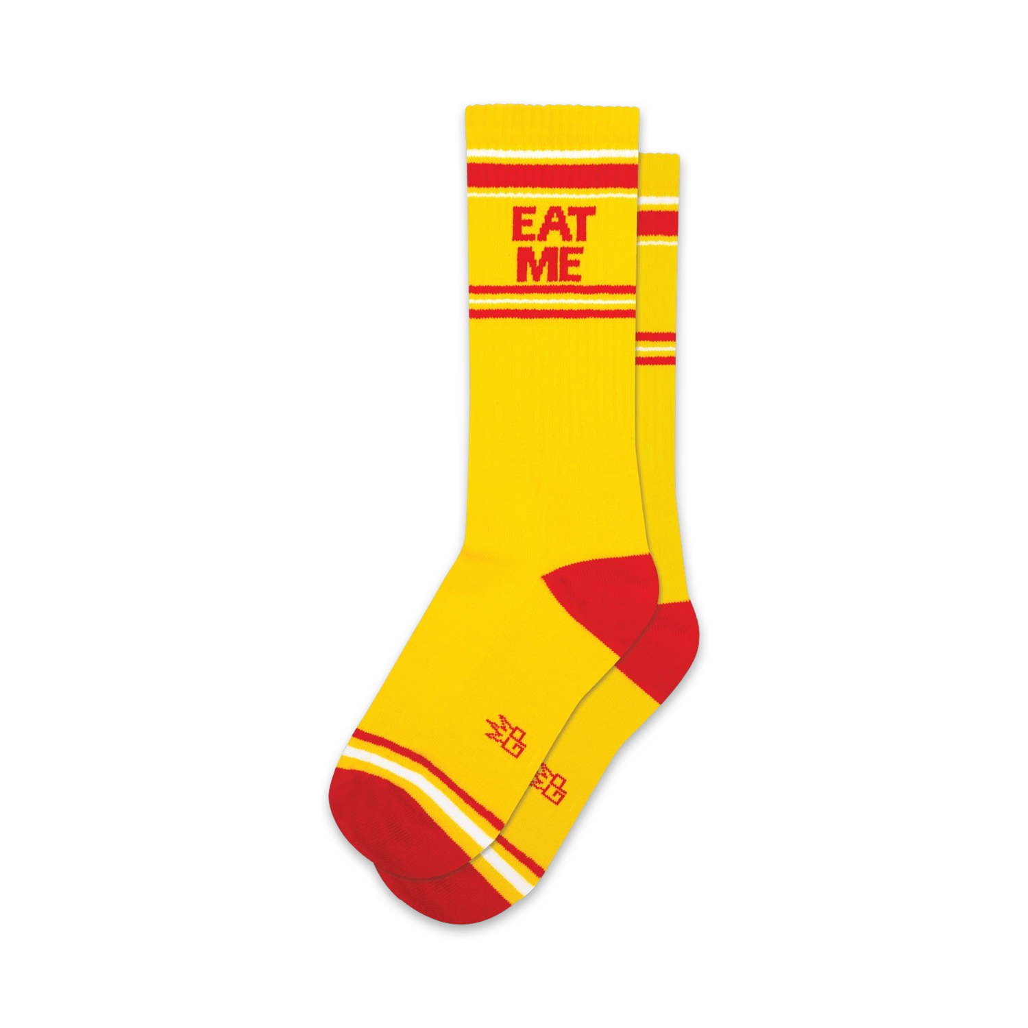 A pair of yellow crew socks with red and white stripes and the words 'EAT ME' in red.  Small logo on the sole.