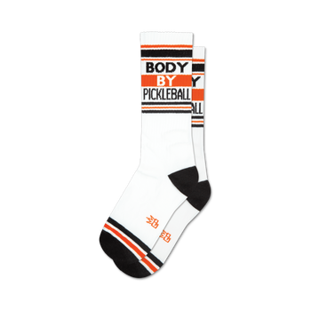 pickleball-themed crew socks in white with black and orange stripes. "body by pickleball" text and orange toes/heels. unisex, crew length xl.  